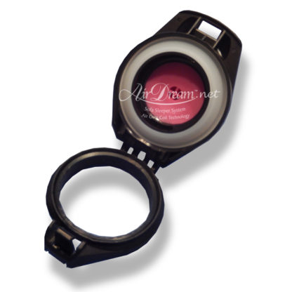 A black and silver camera lens with pink filter.
