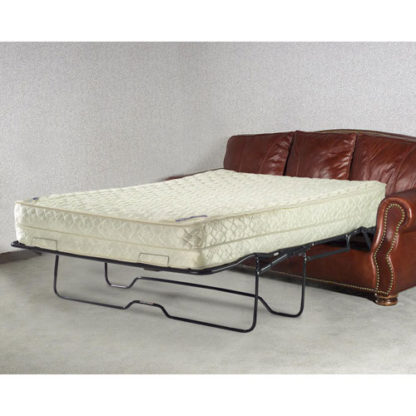 A couch that has been folded down to be used as a bed.